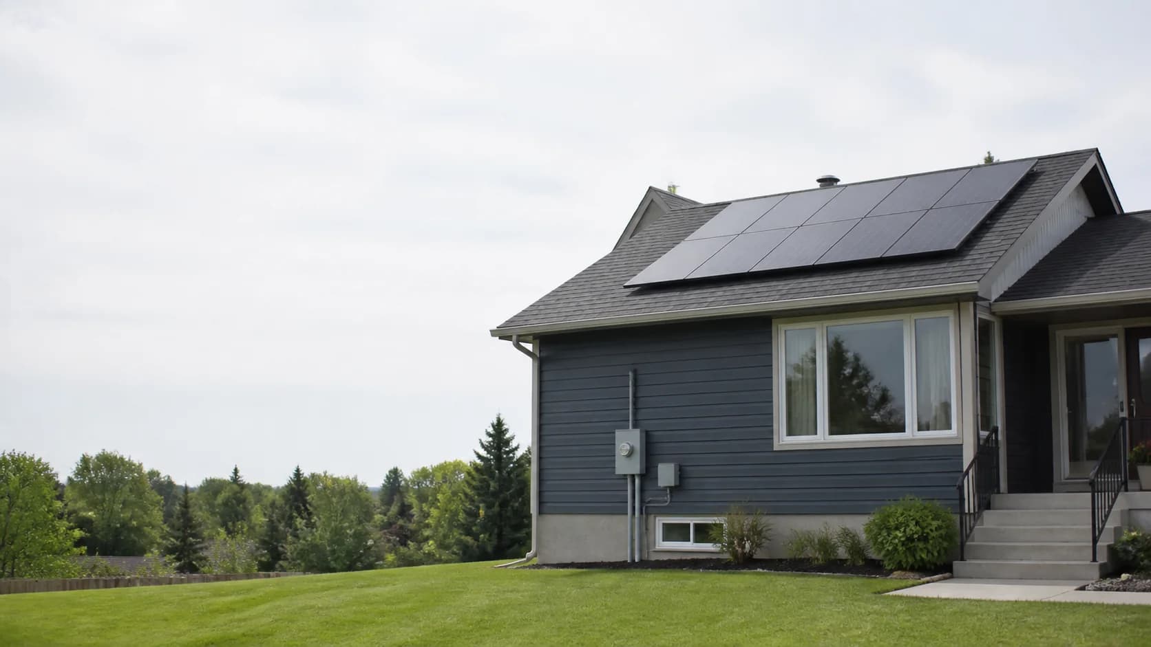 Calgary Area home with a rooftop solar array and a clean exterior electrical service connection